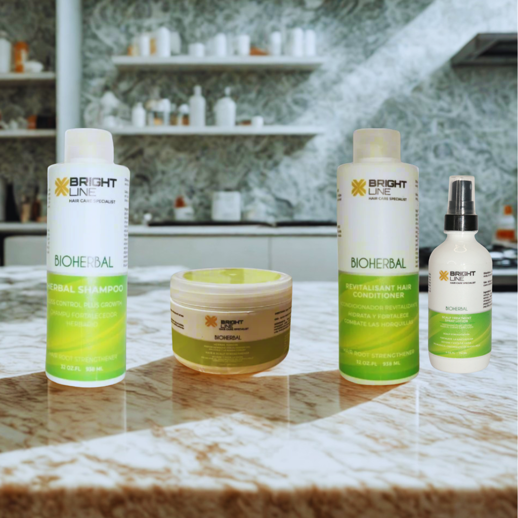 Image of the Bioherbal Hair Care Bundle by Bright Line, featuring four products on a marble counter: Herbal Shampoo, Conditioner, Puddin Hair Mask, and Scalp Spray. Products are arranged in a well-lit, modern salon setting.